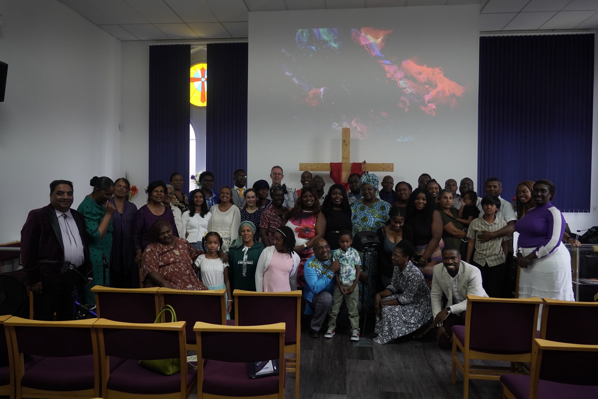 Church members gathered together in a prayer circle